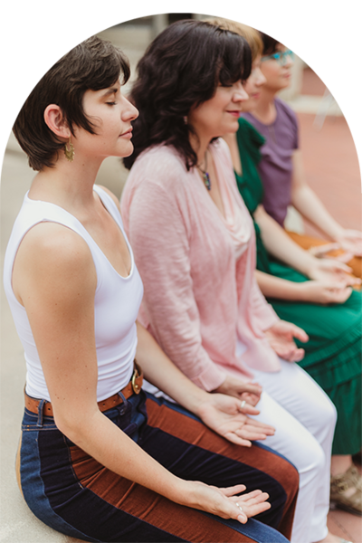 three people with hands in the air psychic reading