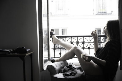 A woman eating a croissant