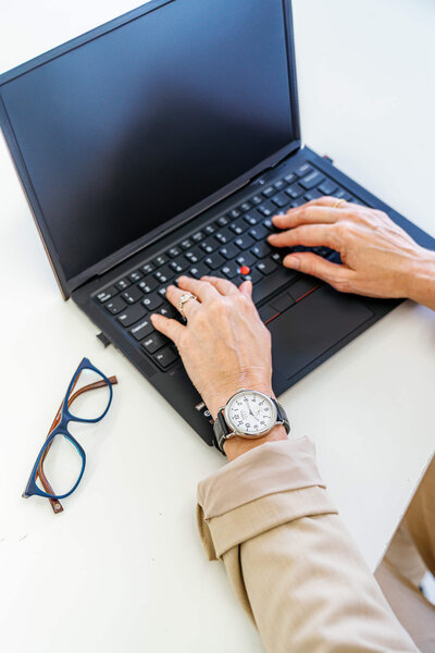 melissa greenwell, typing on a computer during a coaching session