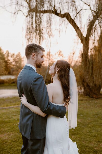 Full length image of bride with veil and dress.