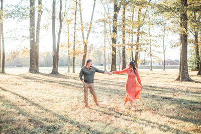 photo of couple dancing in the park for their engagement photos