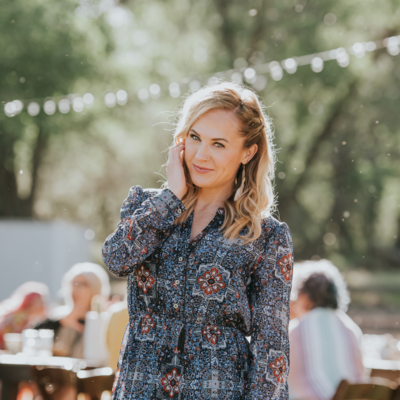 woman smiling in white shirt