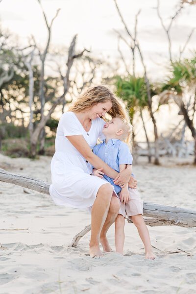 mom hugging her son at Folly Beach 