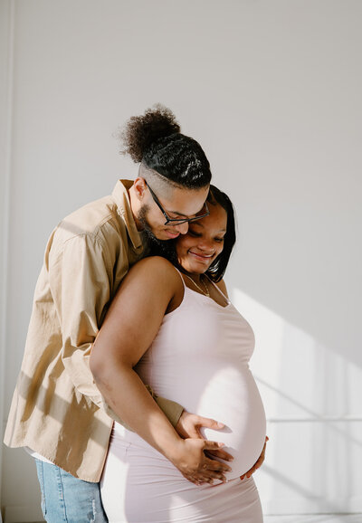 expecting mom looking at her belly
