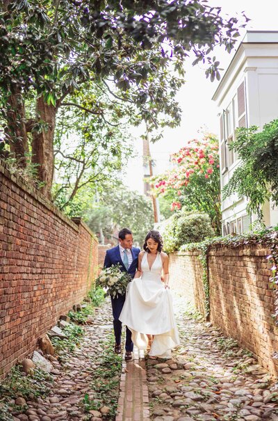 wedding couple walk in an alley in old town Alexandria in virginia