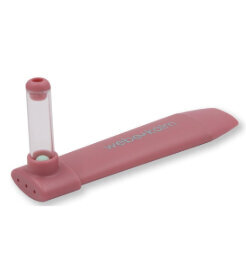 pink long oral tool that looks like a kazoo