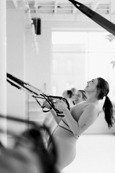 woman working out in a barre class