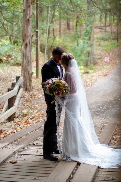 bride and groom kiss