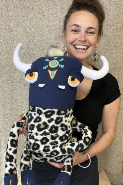 Natalie holding fabric animal sculpture