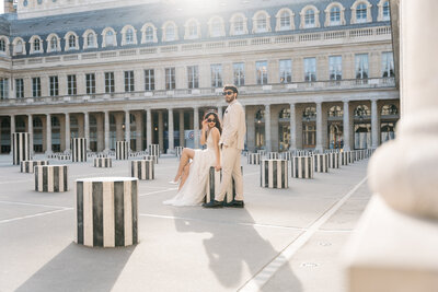 Couple eloping in front of the Eiffel Tower on Pont Alexandre iii