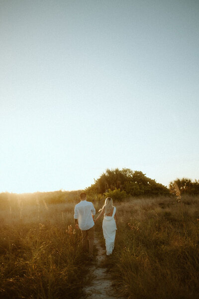Couple eloping on the sandy shores of Cannon Beach, with the iconic Haystack Rock in the background, creating the perfect coastal elopement setting.