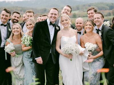 Couple smiling with their bridal party at Pippin Hill in Charlottesville Virginia
