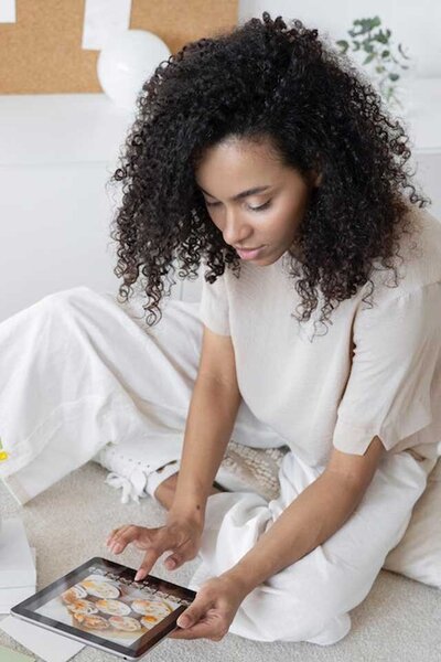 Young woman reading tablet