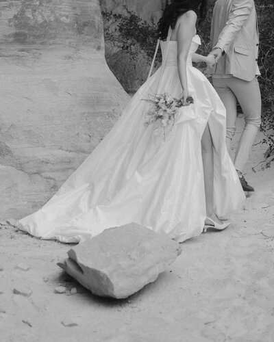 Black and white detail of a bride in a satin ballgown for an elopement at  Amangiri in Utah