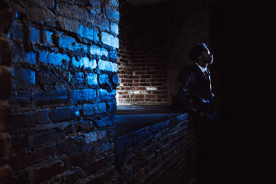 A sample image from Philadelphia wedding photographer Daring Romantics. A dramatic portrait of a young man.