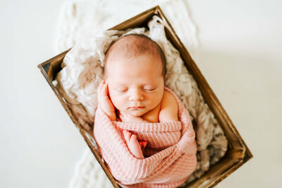 Springfield Mo newborn photographer captures framed photos of maternity and newborn photos in studio
