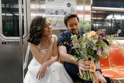 NYC city hall elopement couple with fox fodder farm and casual dress on subway