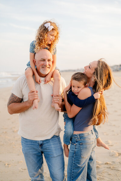Sisters hugging on beach