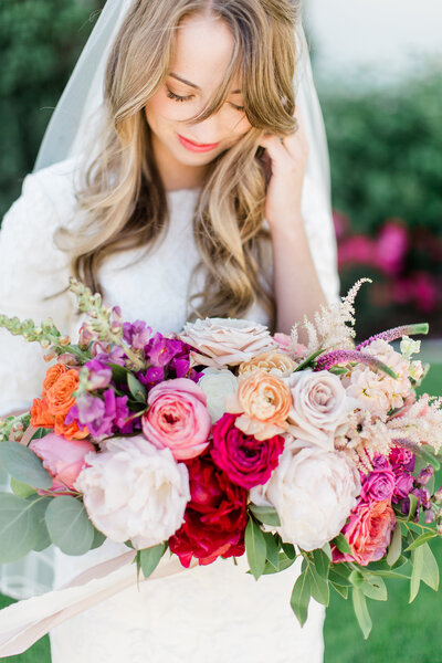 Colorful wedding bouquet for stunning bride taken by a Salt Lake City Wedding Photographer