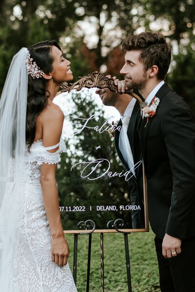 Bride and groom smiling at each other