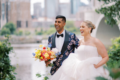bride and groom portrait with colorful flowers