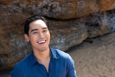 Aleczander Gamboa profile headshot at Sandringham beach for Dewy Content