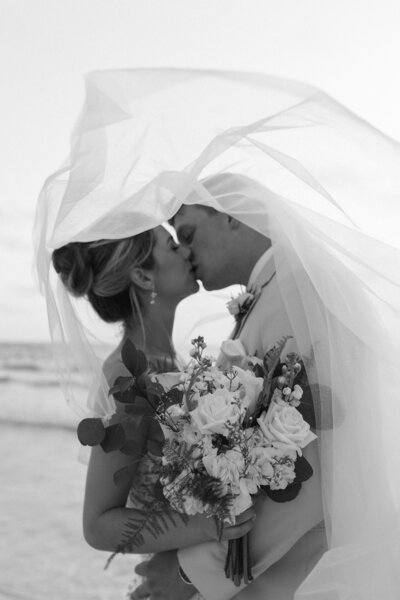 Bride and groom embracing on their wedding day, photographed by Ryann B Photography, an Indianapolis-based wedding photographer.