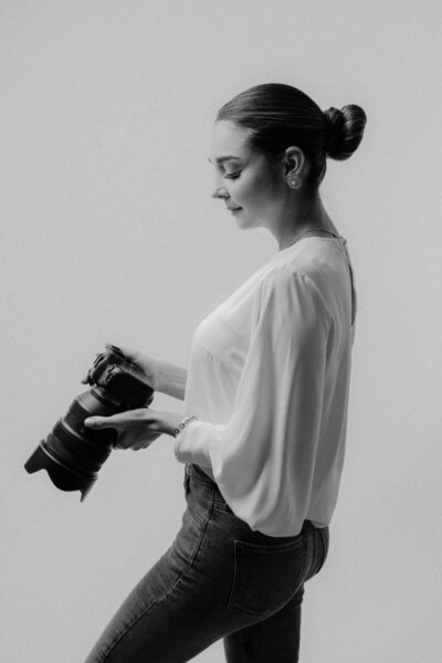 Black and white portrait of Amia Marcell, a luxury wedding photographer known for her editorial and fine art approach, capturing timeless love stories across the U.S