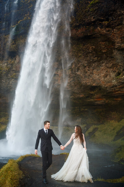 This couple eloped by a waterfall in Iceland.