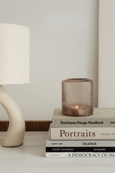 Image of a stack of books with a lamp