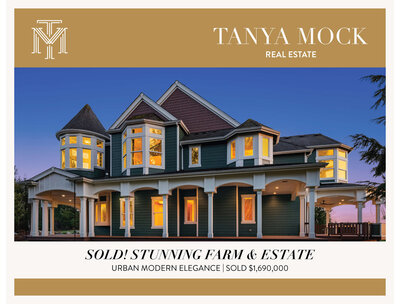 A large, elegant modern farmhouse with turret, multiple gables, and wraparound porch at dusk—sold for $1,690,000 by Tanya Mock Real Estate in collaboration with brand strategist Sweet Pea Ink Creative.