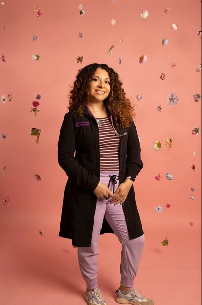 Harj leaning against a wall and laughing
