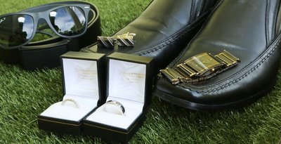 Groom's accessories and rings. Photo by Ross Photography, Trinidad, W.I..