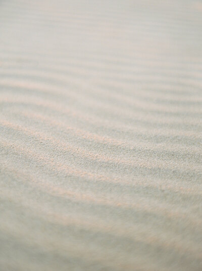 Soft sea sand symbolizing tranquility, natural beauty, and a calming connection. All things you can experience with  wellness coaching and/or CFT treatment.