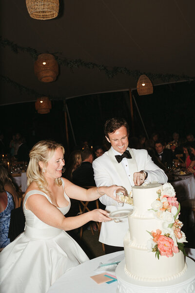 bride and groom cutting the cake