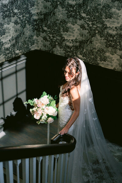 Bridal portrait of bride on staircase at dallas wedding