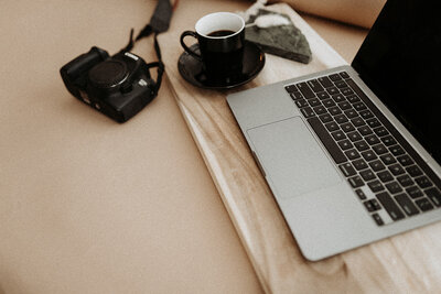 Desktop with Laptop, Camera, and Coffee Mug