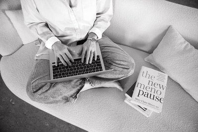 Perimenopause and menopause wellness coach researching hormone health and natural healing methods for midlife women