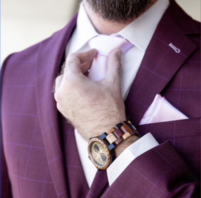 A man wearing men’s dress clothing and suit accessories