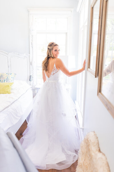 Bride in dress before the wedding by Tiffany McFalls.
