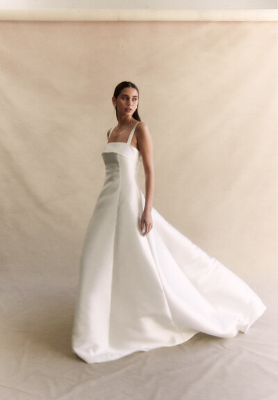 black and white image bride wearing feathered wedding dress