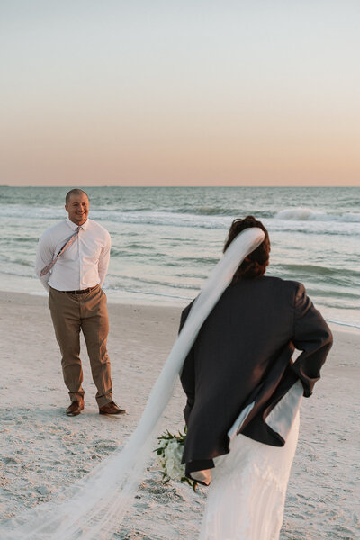 newlyweds dip and kiss brick arch