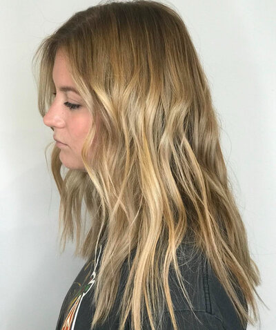 Image of client with blonde full highlights.