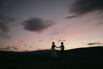 Bride and groom during wedding golden hour portrait session at Idaho wedding - photographed by The Storytellers