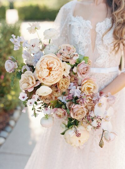 yellow cream and rose colored bridal bouquet