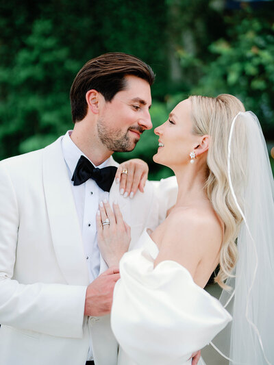 BRide and groom looking at  eachother at their wedding in Salamander Resort.