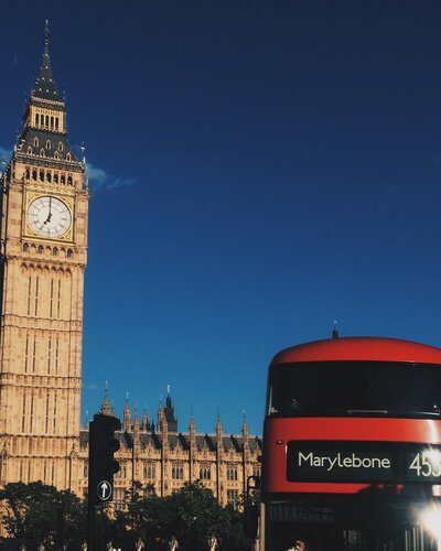 Photo of European Buildings and a Red Bus