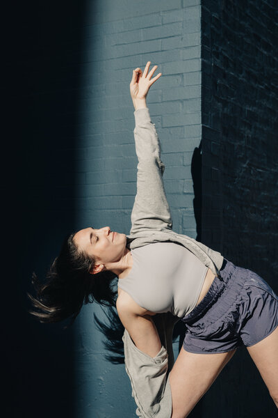 Jordan Hana in a yoga flow triangle pose