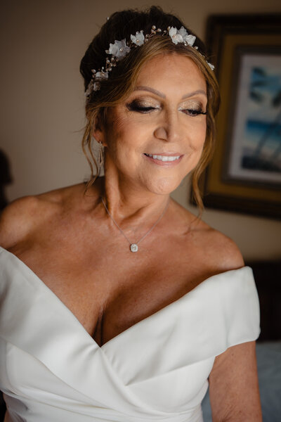 This portfolio image highlights a stunning bridal makeup look created by Book Sothana, a premier bridal makeup artist in Jacksonville, FL. Featuring radiant skin, soft gold eyeshadow, and defined lashes, this makeup enhances natural beauty while providing a camera-ready, elegant finish perfect for wedding celebrations. Every bridal makeup session at Book Sothana is customized based on your features, skin type, and wedding theme to ensure you feel confident, beautiful, and true to yourself on your special day. Whether you’re looking for a full glam or a softer, classic look, Book Sothana delivers flawless, lasting results that photograph beautifully. Based in Jacksonville, FL at 9303 Baymeadows Rd 105, #120, Book Sothana specializes in enhancing your natural beauty while offering a calming, personalized experience. To book your bridal makeup session, contact (904) 597-0867 or visit https://booksothana.com/. Let’s create your dream bridal look!