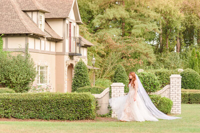 A bride walks across the front lawn at the Key Rose Estate.
